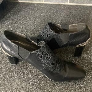 Fun slip on boots.  Black with silver on the heel.  Brighton Rand.  Size 10